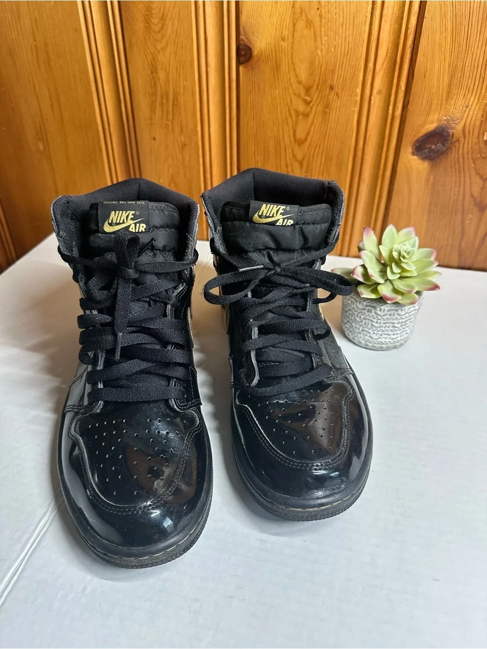 Nike Air High-Top Sneakers in Black with Gold Logo